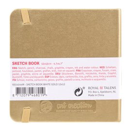 Gold sketchbook with label and branding on a white background