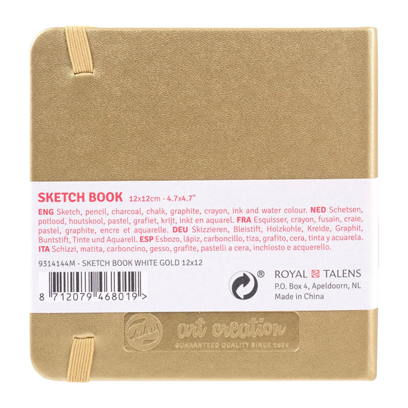 Gold sketchbook with label and branding on a white background