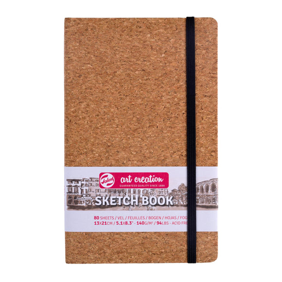 Cork notebook with a visible brand label on a white background