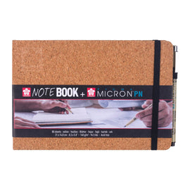 Cork-bound notebook with a black strap and Sakura branding on a white background