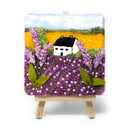 Felted landscape with a house and lavender on a small easel