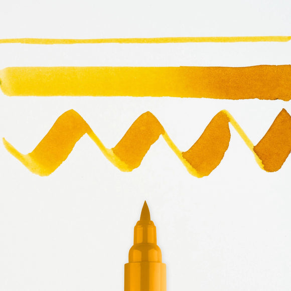 Yellow marker pen with wavy line on white background