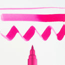 Pink marker with wavy lines on a white background