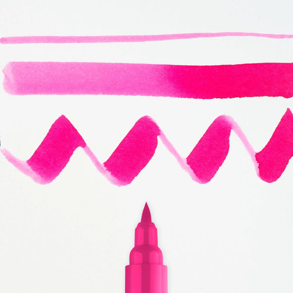 Pink marker with wavy lines on a white background