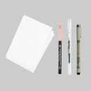 Set of art supplies including a notebook, markers, and a pen on a white background