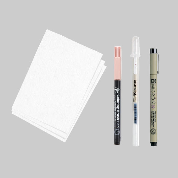 Set of art supplies including a notebook, markers, and a pen on a white background