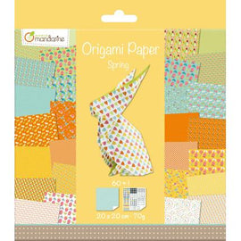 Packaged origami paper with colorful patterns and a bunny design on a yellow background.