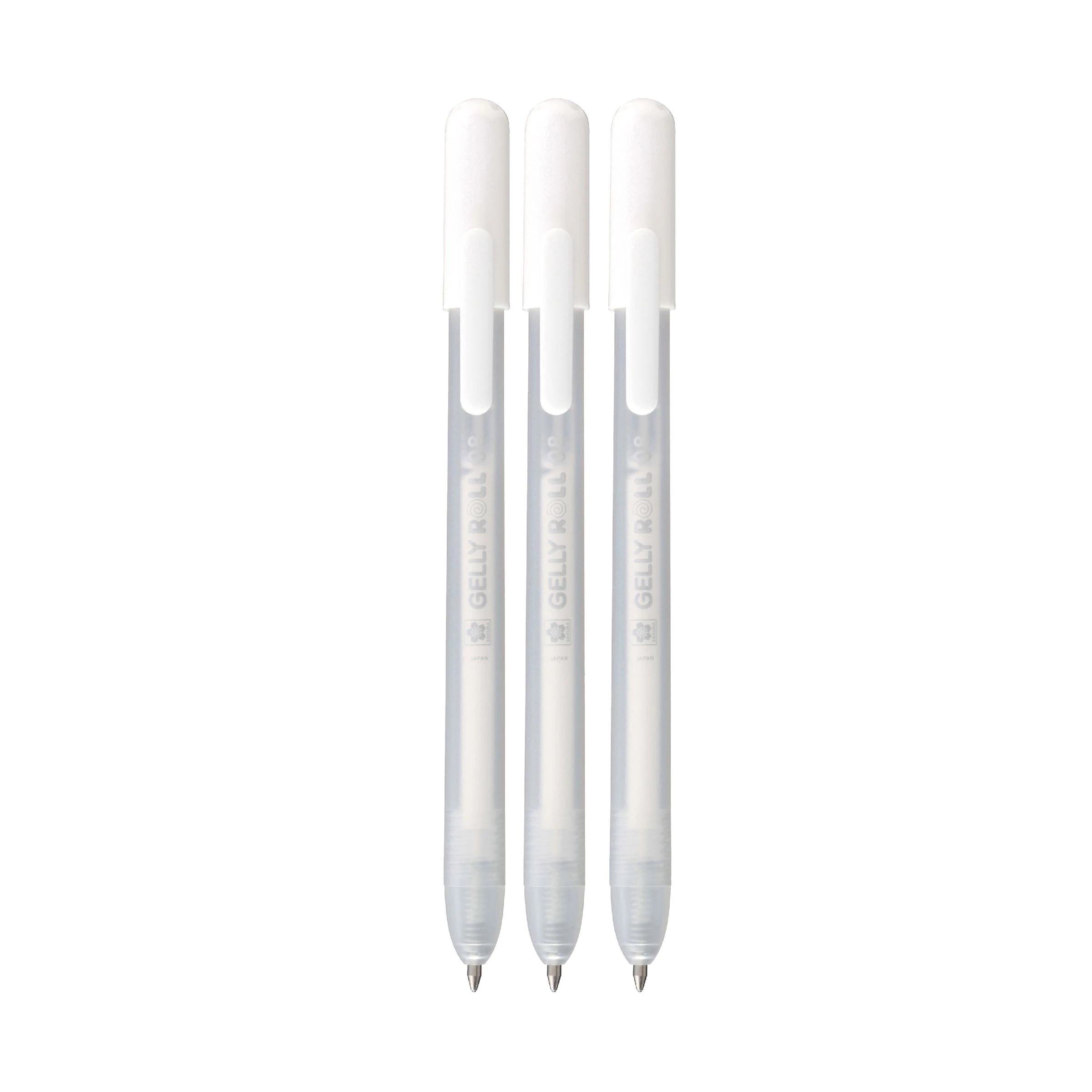 Three white pens with silver accents on a white background