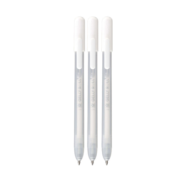 Three white pens with silver accents on a white background