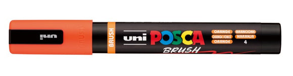 Uni Posca brush marker with orange body and black top on a white background