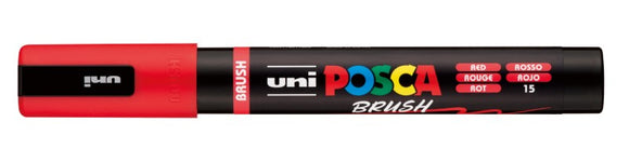 Uni Posca brush marker with red body and black top on a white background