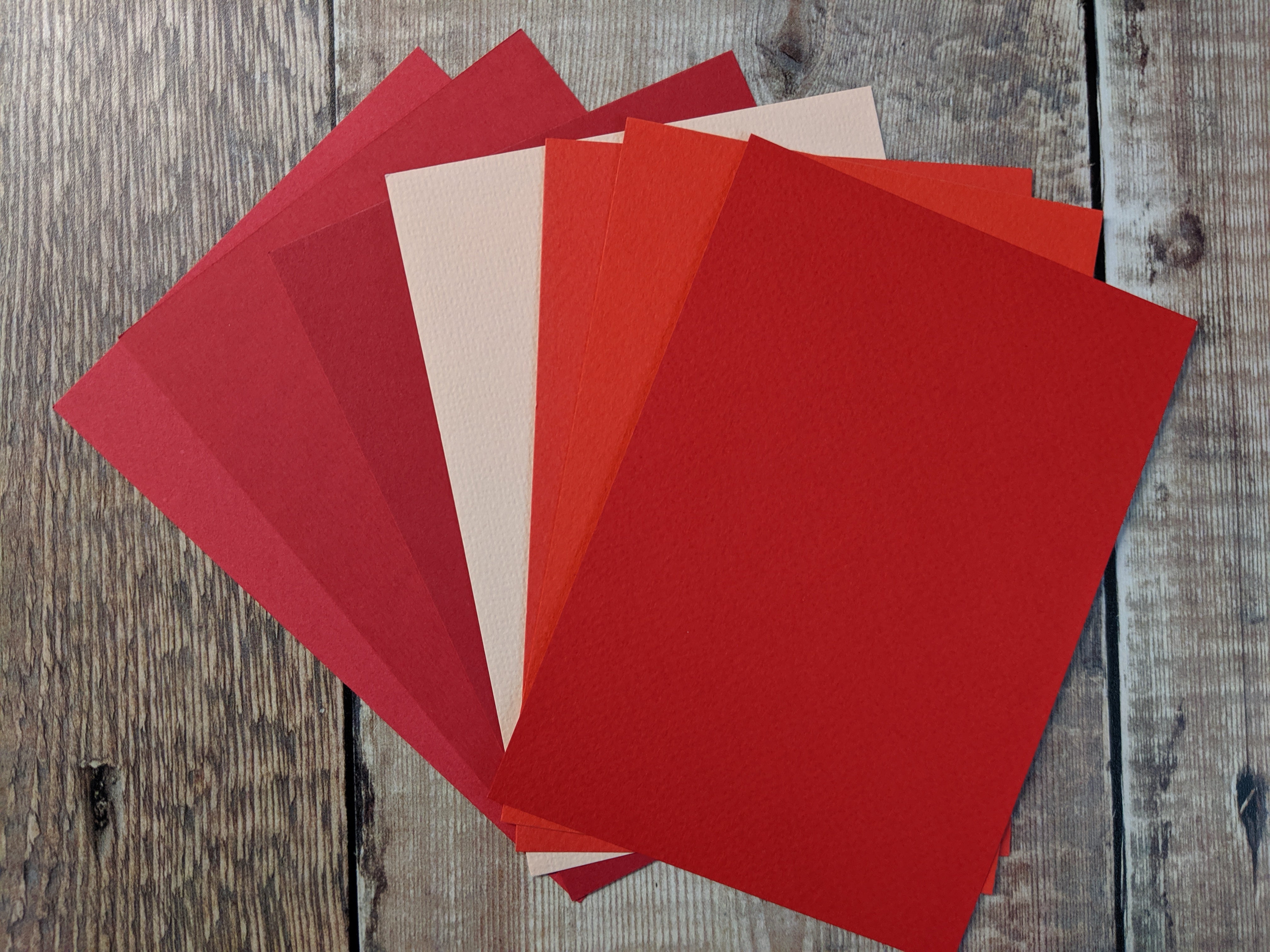 7  Layered pack of Poppy colours Hammered 160 gsm paper A4