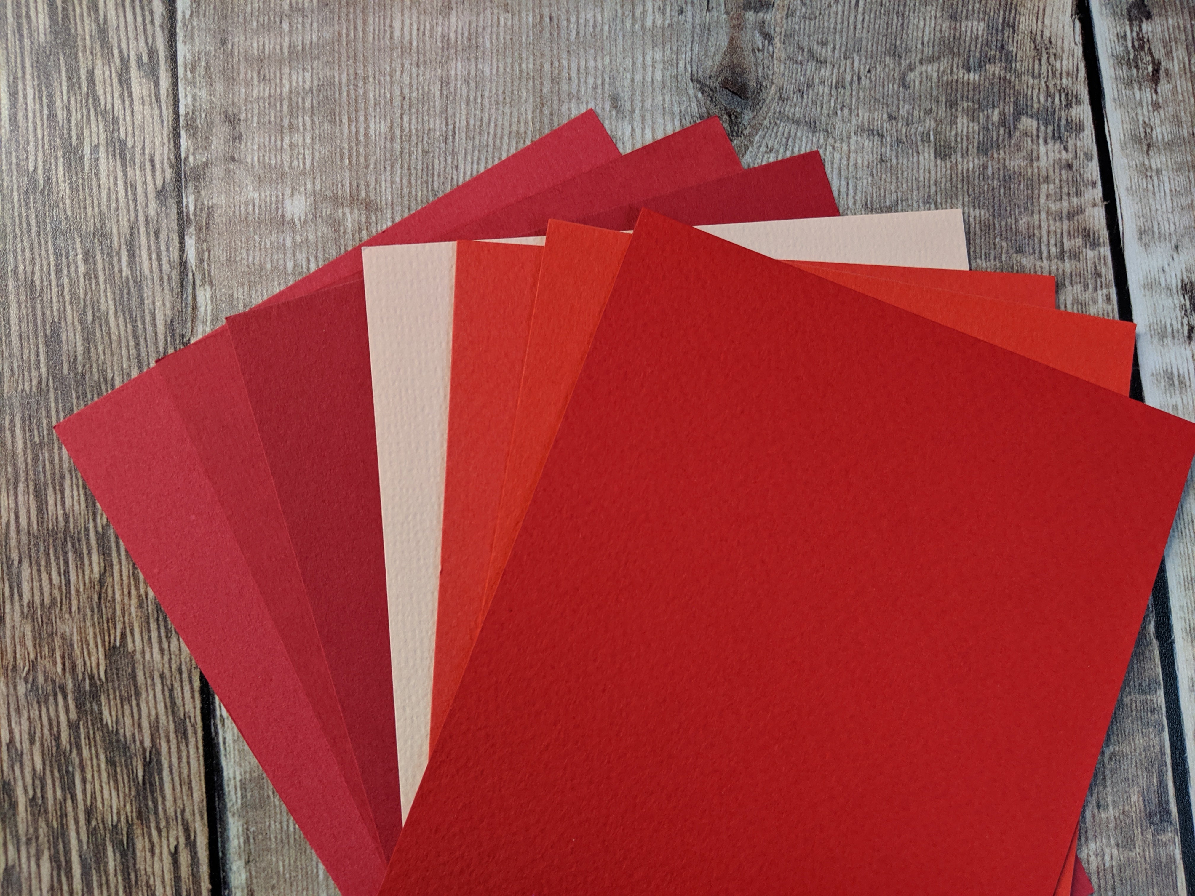 7  Layered pack of Poppy colours Hammered 160 gsm paper A4 - 0