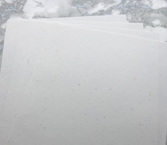 Gold and Silver Leaf 120 gsm specialist inclusion paper. Made using traditional methods to make, this is a wonderful and unusual paper contains randomised scattering of beautiful shimmering pieces of silver and gold leaf. 100% recycled and acid free, no bleach or acids are used during the making process. 